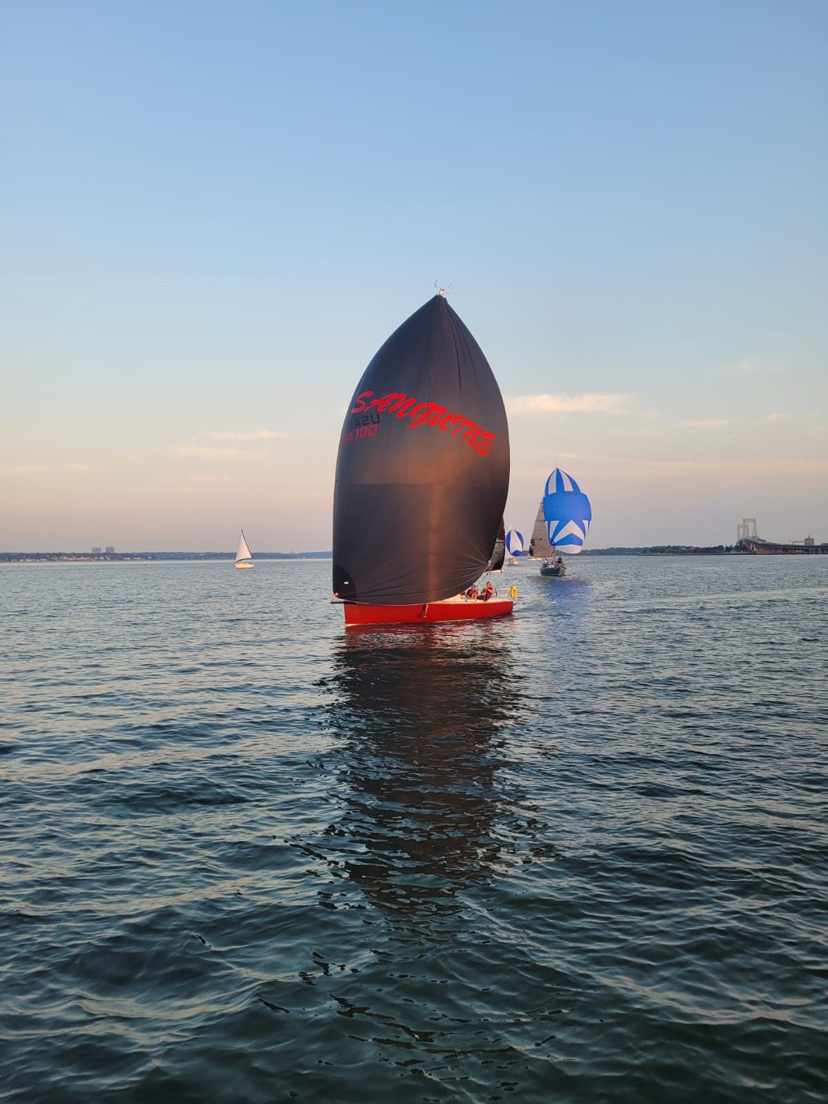 Sanguine under spinnaker at dusk during the Block Island Race